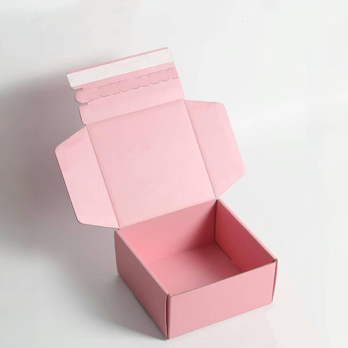 Self sealing shipping boxes